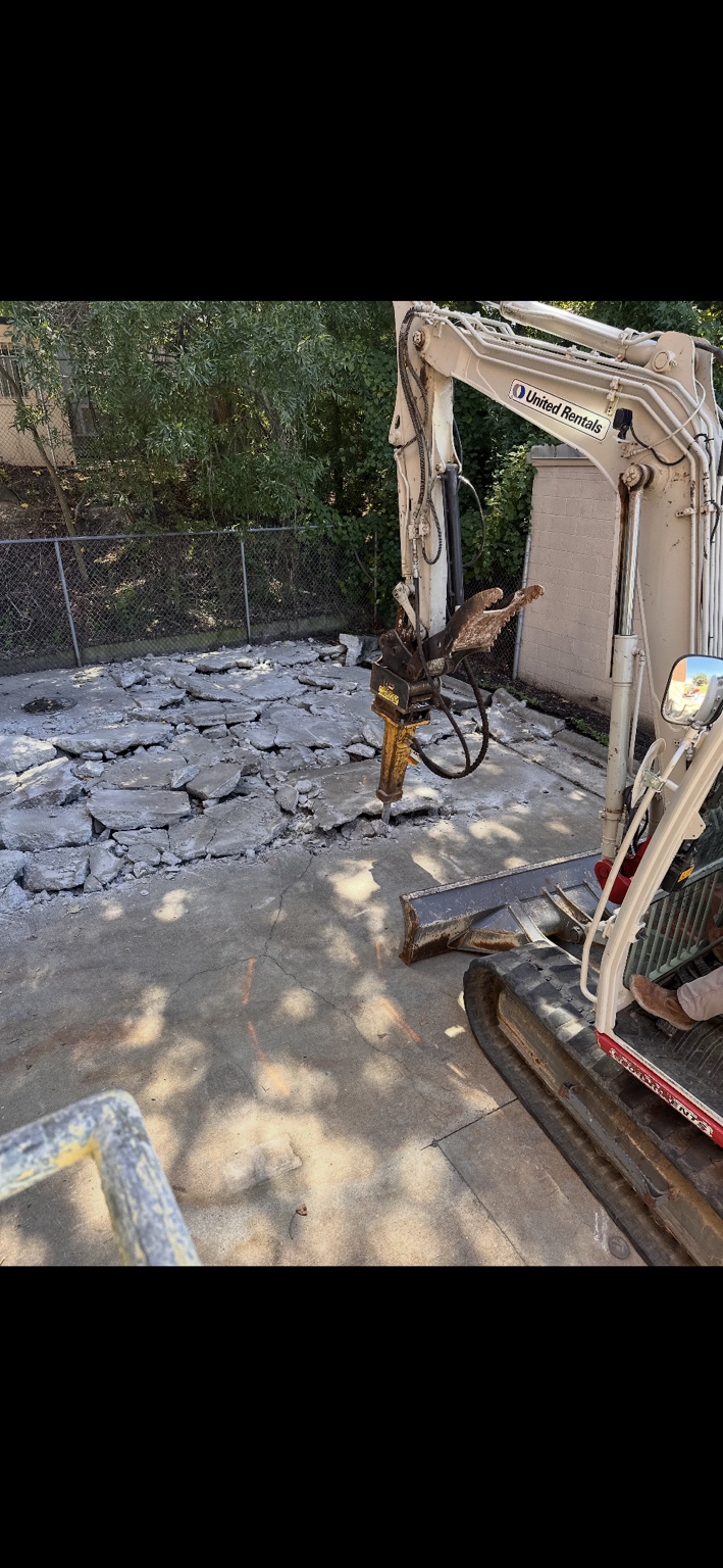 Concrete removal using a hydraulic breaker